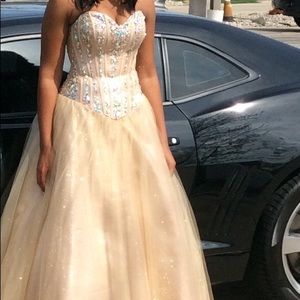 Women’s light gold corset prom dress.